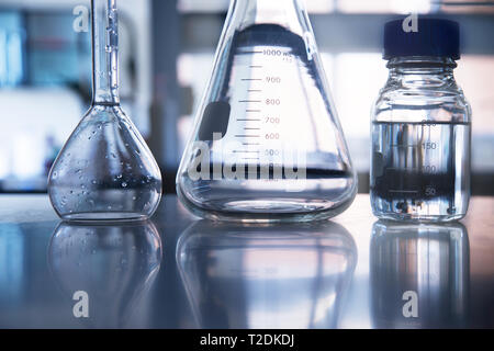 science lab with clear blue background and test tubes with blue ...