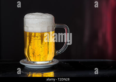 Glass of beer with drops of water Stock Photo