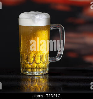 Glass of beer on the dark background Stock Photo