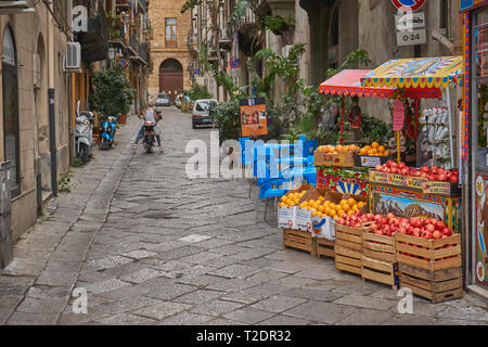 Palermo, Italy - October, 2018. A colourful stall selling fruits in a narrow street in the historical centre. Stock Photo