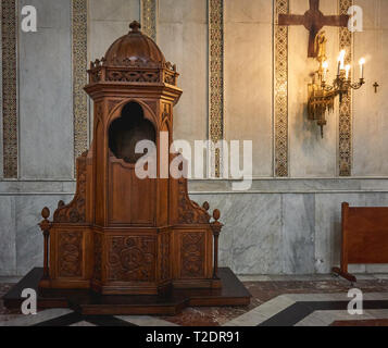 Monreale, Italy - October, 2018. A confessional booth inside the Cathedral, one of the greatest examples of Norman architecture. Stock Photo