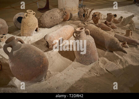 Favignana, Italy - November, 2018. Group of ancient terracotta vases (or amphorae) found in the Mediterranean Sea from a shipwreck. Stock Photo