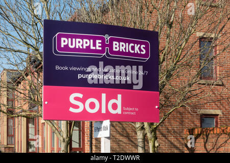 Purple Bricks Sold Sign Stock Photo