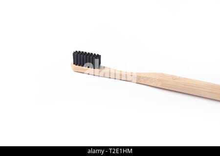 Black Bamboo toothbrush close up isolated on white background ECO friendly natural material oral health concept Stock Photo