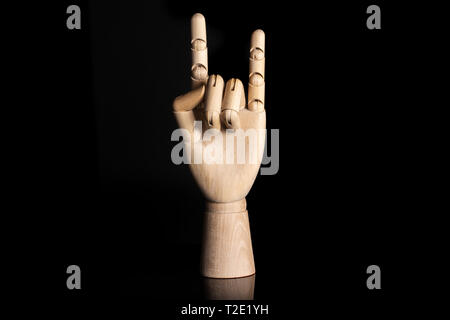 Sign of the horns. deaf sign language isolated on black glass Stock Photo