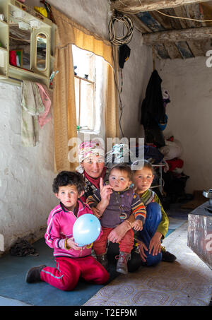 bayan Ulgii, Mongolia, 1st October 2015: mongolian nomad woman with her kids at her home Stock Photo