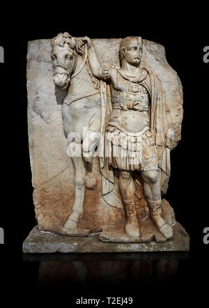 Roman Sebasteion relief sculpture of  an Imperial prince as Diokouros, Aphrodisias Museum, Aphrodisias, Turkey.   Against a black background.  An impe Stock Photo