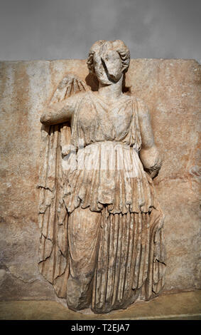 Roman Sebasteion relief sculpture of Ethnos with belted peplos, Aphrodisias Museum, Aphrodisias, Turkey.  Against a grey background.  The matronly fig Stock Photo