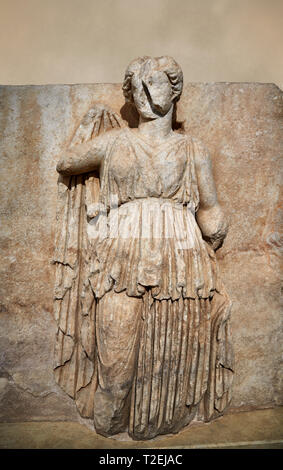 Roman Sebasteion relief sculpture of Ethnos with belted peplos, Aphrodisias Museum, Aphrodisias, Turkey.  Against an art background.  The matronly fig Stock Photo