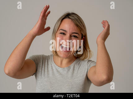 Portrait of beautiful shocked woman winning the lottery or having great success with surprised and happy face and gestures. In People, Facial Expressi Stock Photo