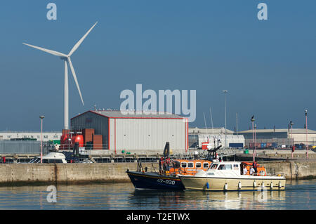 RNLI lifeboat bringing a motorboat with engine failure back to port, Lowestoft, Suffolk, UK. Stock Photo