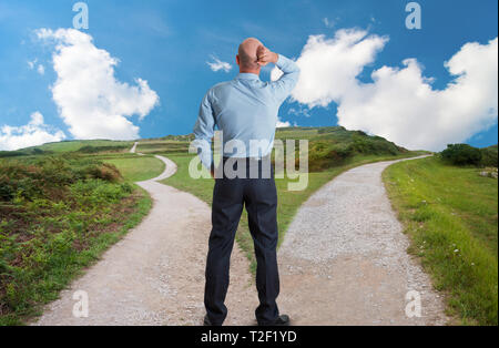 man at fork in the road concept image Stock Photo