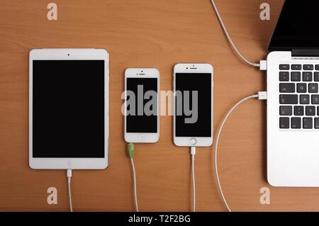 Apple mobile devices, computers, screens black, charging, Germany Stock Photo