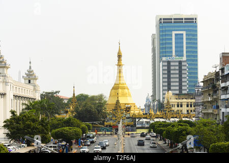 View from above, daily traffic and city life on the streets of Yangon during sunset. Sule Pagoda in the background. Stock Photo