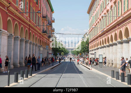 Looking down Avenue Jean Médecin, a street located in the centre of Nice, France, and one of the main north-south traffic arteries. Stock Photo