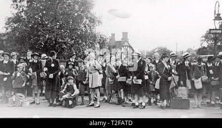 SECOND WORLD WAR EVACUEE SCHOOL CHILDREN from Sandhurst  School  line the platform at Catford, South London, in the summer of 1940. Note the barrage balloon behind them. Stock Photo