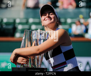 Beijing, USA. 17th Mar, 2019. Bianca Andreescu of Canada poses with her trophy after the women's singles final match of the BNP Paribas Open tennis tournament against Angelique Kerber of Germany in Indian Wells, California, the United States, on March 17, 2019. Andreescu won 2-1. Credit: Zhao Hanrong/Xinhua/Alamy Live News Stock Photo