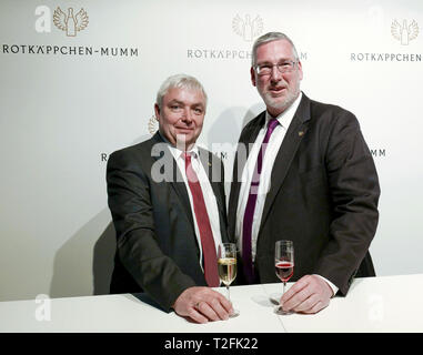 Leipzig, Germany. 02nd Apr, 2019. Ulrich Wiegel (l), Managing Director for Production, Quality Management, Technology and Purchasing, stands after the Balance sheet press conference of Rotkäppchen-Mumm Sektkellereien GmbH next to his successor Mike Eberle. The company provided information on the business figures for 2018 and an outlook for the 2019 financial year. Credit: Peter Endig/dpa/Alamy Live News Stock Photo