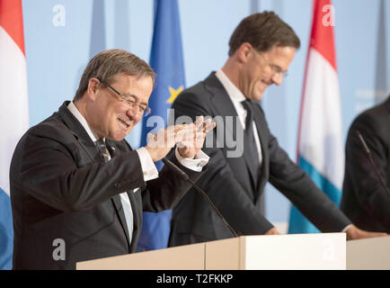 02 April 2019, Luxemburg: Armin Laschet (CDU, l), Prime Minister of North Rhine-Westphalia, and Mark Rutte, Prime Minister of the Netherlands, laugh at a joint press conference. The Benelux states and North Rhine-Westphalia want to intensify their cooperation. Photo: Bernd Thissen/dpa Stock Photo