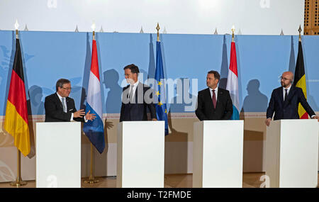 02 April 2019, Luxemburg: Armin Laschet (CDU, l-r), Prime Minister of North Rhine-Westphalia, Mark Rutte, Prime Minister of the Netherlands, Xavier Bettel, Prime Minister of Luxembourg and Charles Michel, Prime Minister of Belgium, give a joint press conference. The Benelux states and North Rhine-Westphalia want to intensify their cooperation. Photo: Bernd Thissen/dpa Stock Photo