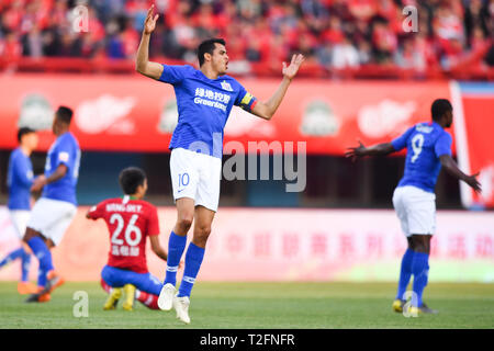 Zhengzhou, China. 31st Mar, 2019. Colombian football player Giovanni Moreno of Shanghai Greenland Shenhua celebrates after scoring against Henan Jianye in their 3rd round match during the 2019 Chinese Football Association Super League (CSL) in Zhengzhou city, central China's Henan province, 31 March 2019. Shanghai Greenland Shenhua defeated Henan Jianye 2-1. Credit: Matt Buxton/Alamy Live News