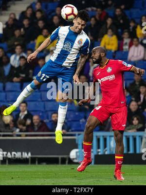 Barcelona, Spain. 2nd Apr, 2019. RCD Espanyol's Hernan Perez (L) vies with Getafe's Dimitri Foulquier during a Spanish league soccer match between RCD Espanyol and Getafe in Barcelona, Spain, on April 2, 2019. The match ended 1-1. Credit: Joan Gosa/Xinhua/Alamy Live News Stock Photo