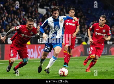 Barcelona, Spain. 2nd Apr, 2019. RCD Espanyol's Esteban Granero (2nd L) vies with Getafe's Vitorino Antunes (1st L) during a Spanish league soccer match between RCD Espanyol and Getafe in Barcelona, Spain, on April 2, 2019. The match ended 1-1. Credit: Joan Gosa/Xinhua/Alamy Live News Stock Photo