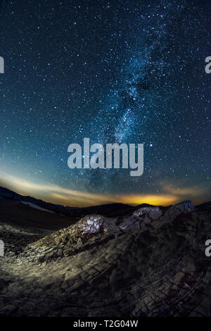 The Milky Way galaxy seen from the Muddy Volcanoes in Romania on a clear night with a sky full of stars Stock Photo