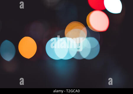 Abstract bokeh lights in city blurred night background Stock Photo