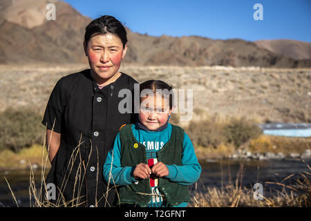 bayan Ulgii, Mongolia, 1st October 2015: mongolian nomad mother and daughter in a nature Stock Photo