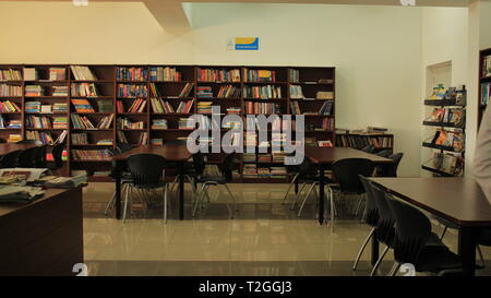 Quiet Empty School Library with Chairs and Tables Stock Photo