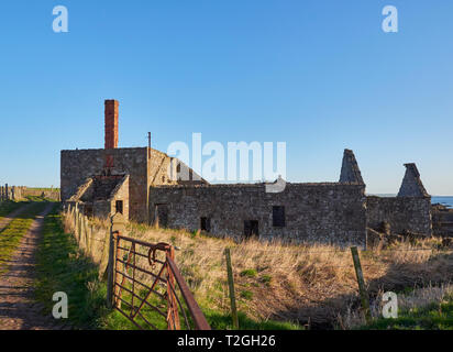 Derelict and Abandoned Farm Cottages and Buildings at Usan on the East Coast of Scotland, near Montrose in the early morning light on a Spring Day. Stock Photo