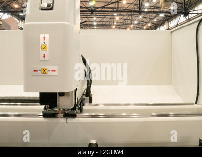 automated industrial programmable laser cutting engraving machine or 3d printer. image inside manufacture facility Stock Photo