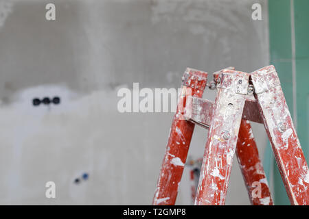 Picture of an unfinished apartment , ladder, concrete walls  - new home in construction Stock Photo