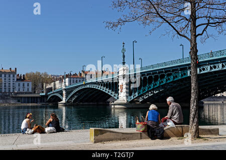 LYON, FRANCE, March 31, 2019 : Berges du Rhone are a series of quays, streets, cycling and walking paths along the Rhone river in Lyon built between 2 Stock Photo