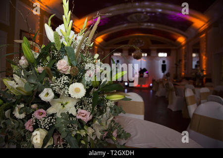 Wedding Reception room, all lit up ready for the first dance, with pretty lights, large room with a dome shaped roof,ready for the wedding celebration Stock Photo