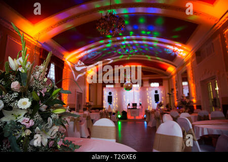 Wedding Reception room, all lit up ready for the first dance, with pretty lights, large room with a dome shaped roof,ready for the wedding celebration Stock Photo