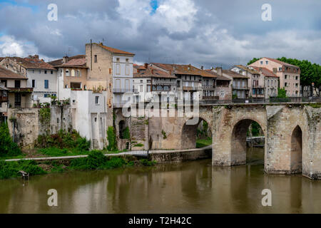 A photograph of the bridge at Villeneuve Sur Lot, France showing the beautiful arches under which the river flows Stock Photo