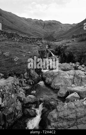 Black and White image of a small stream located in the Lake District National Park in the County of Cumbria,North West England,UK. Stock Photo