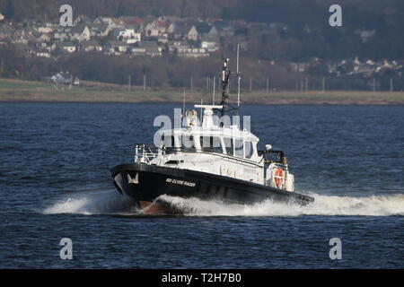 SD Clyde Racer, an Admiralty pilot vessel based on the Firth of Clyde, passing Greenock during the arrival stages of Exercise Joint Warrior 19-1. Stock Photo