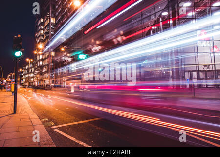 LONDON - MARCH 27, 2019: Traffic light trails on road outside NatWest bank building in City Of London Stock Photo