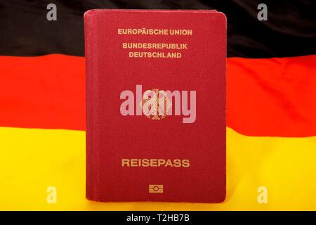 Biometric Passport Federal Republic of Germany, European Union, Black-Red-Golden German National Flag behind, Germany Stock Photo