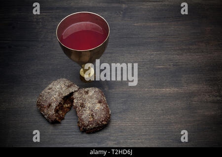 Communion And Passion - Unleavened Bread Chalice Of Wine on wooden table Stock Photo