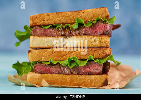 sandwich katsu sando with beef steak. wagyu katsu. japanese cuisine traditional food. Trendy healthy fast food snack Stock Photo