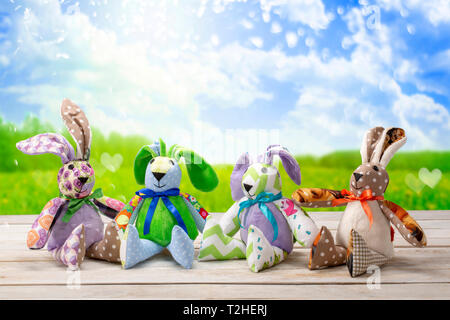 Four Easter bunnies and empty space for text. Easter holiday concept. Stock Photo