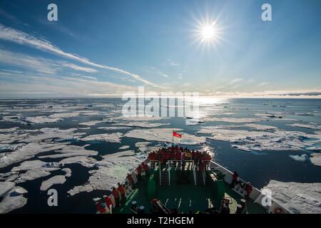 Expedition ship navigating through the pack ice in the Arctic, Svalbard, Norway Stock Photo