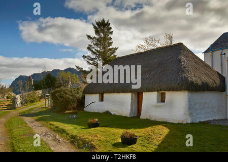 PLOCKTON LOCH CARRON WESTER ROSS SCOTLAND OLD PRESERVED THATCHED COTTAGE BY THE SHORE