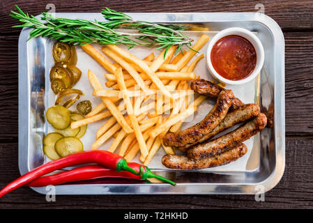 Close up tray with big meal with sausage. Selective focus Stock Photo