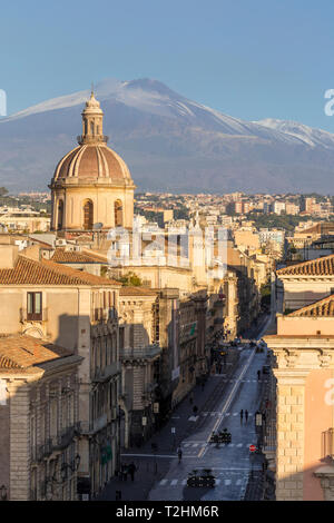 The cupola of Saint Michael church and Mount Etna in the background, Catania, Sicily, Italy, Europe Stock Photo