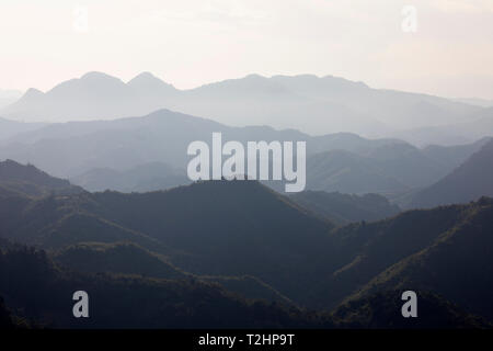 Aerial perspective of mountains viewed from the summit of Pha Daeng Peak Viewpoint, Nong Khiaw, Luang Prabang Province, Laos, Southeast Asia Stock Photo